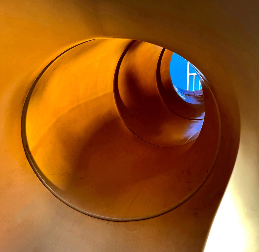 "Throughput", view through a children's slide taken by me in 2022 for week 25, What is It?
