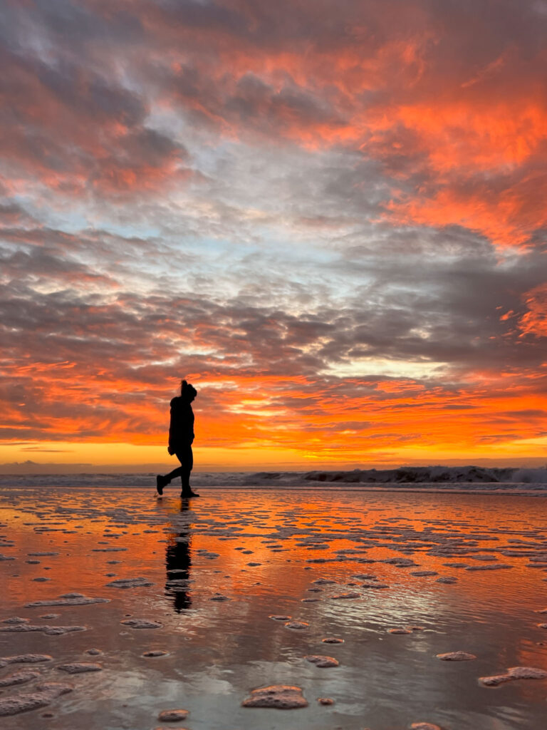 Photo of sunset with more natural colors, stronger subject, more impactful crop, stronger perspective